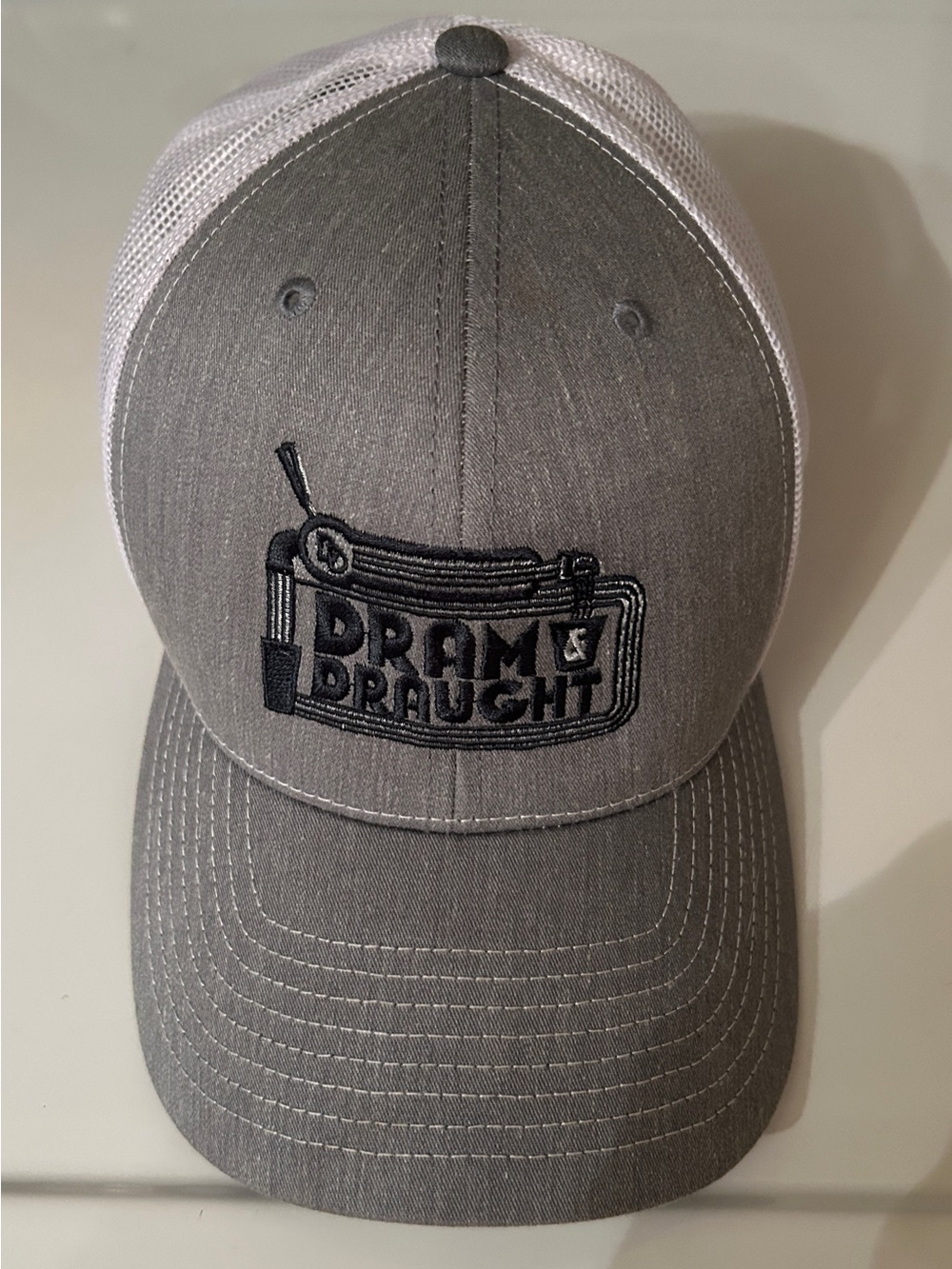 Gray and White Trucker Hat with 'Dram & Draught' Logo